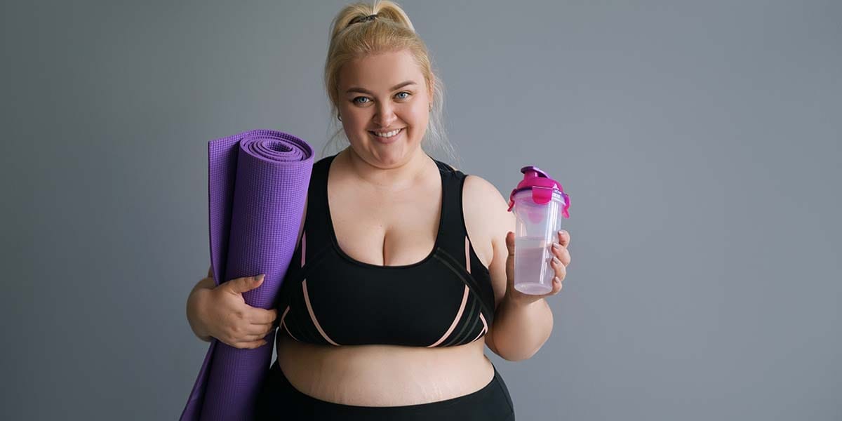 Cirurgião bariátrico: como escolher um bom profissional 4 Mulher obesa preparando-se para fazer exercício - site Dr. Rodrigo Barbosa gastrocirurgião de São Paulo - SP